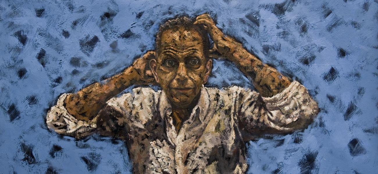 man looking stressed out on a blue background