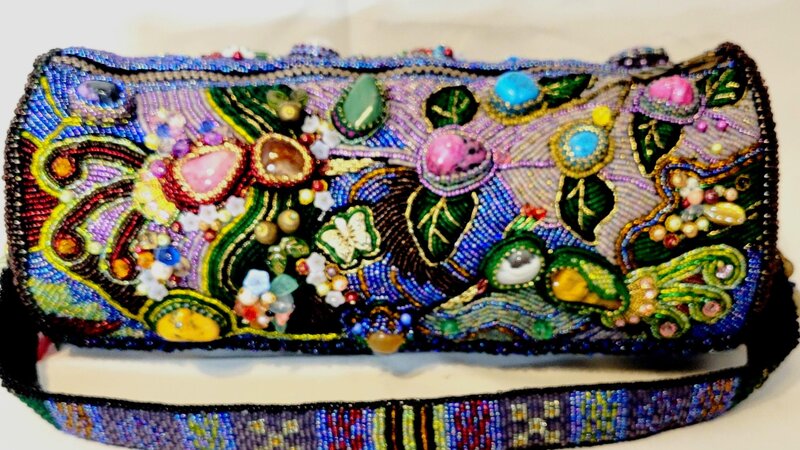The purse is embroidered with beads using various natural semi-precious stones.