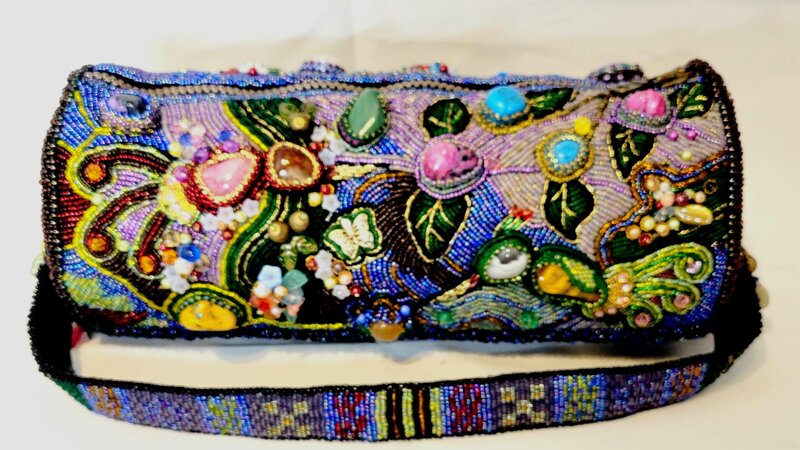 The purse is embroidered with beads using various natural semi-precious stones.