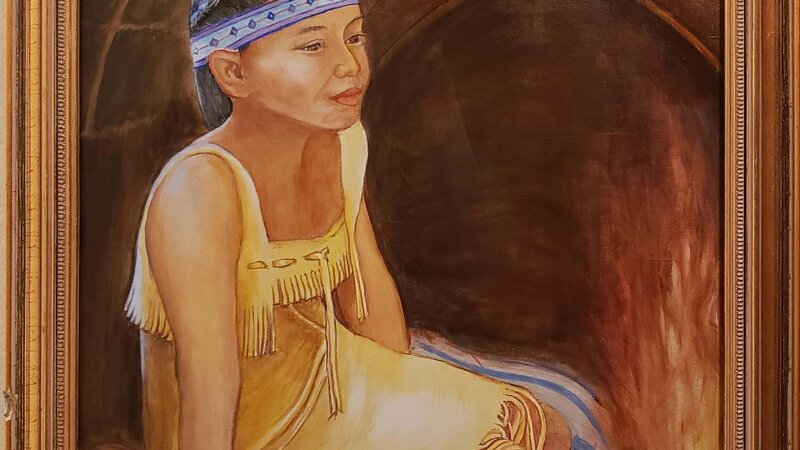 Beautiful Tribal Young Woman dreams by the fire in her Wetu