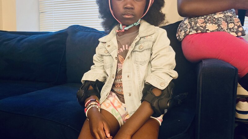 a younger sister is watched over by her older sister