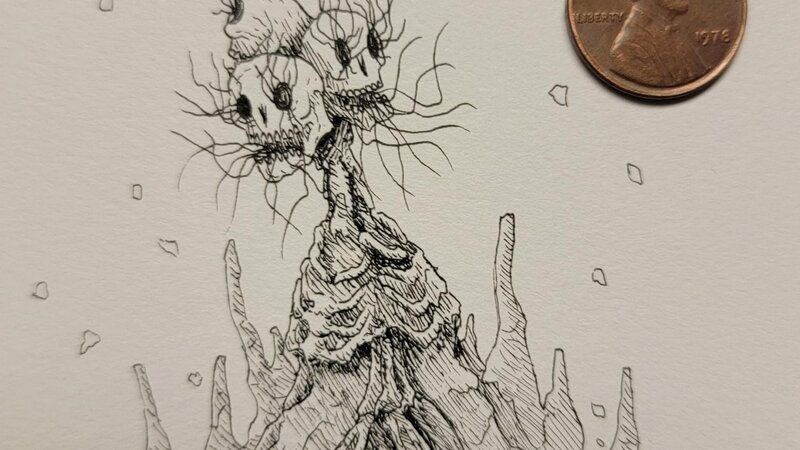 Space Skulls next to a penny