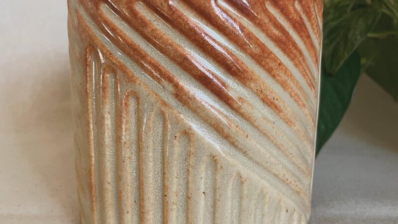 Carved ceramic vessel. 