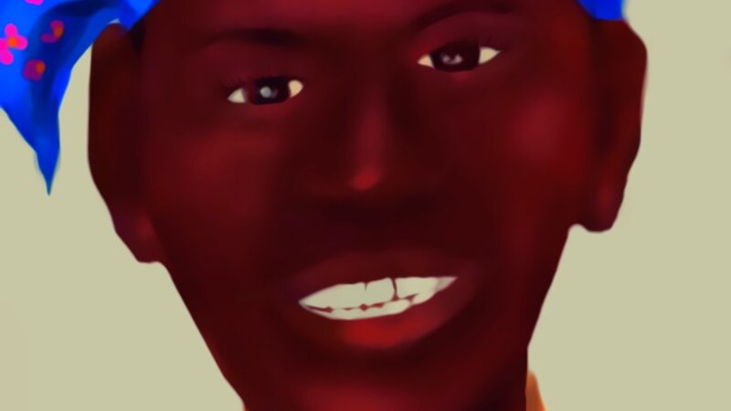 Smiling woman  of dark brown color, wearing a blue and pick scarf