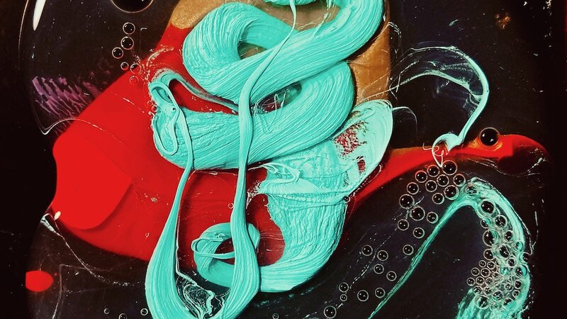 Acrylic paint and liquid on black surface, 2020.