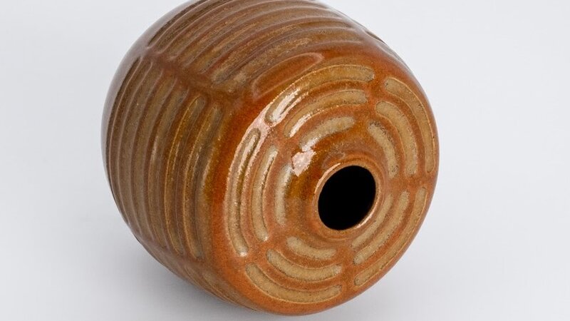 Carved stoneware vessel