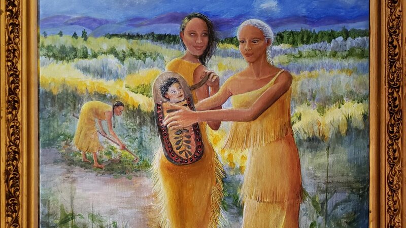 Cradleboard - 3 Generations - Mother slips the Cradleboard off her back to Grandmother's welcoming arms