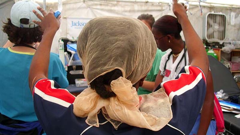 "Woman praying over dying baby", 2010