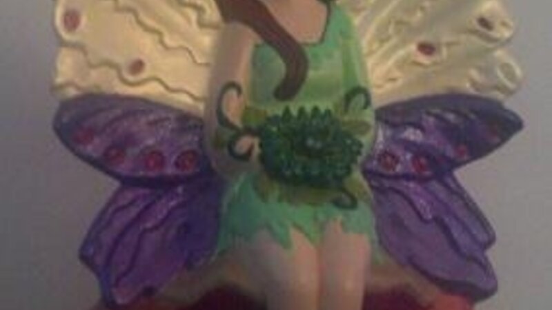 Fairy Seated on Mushrooms