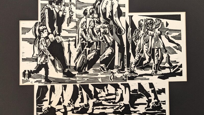 Block print of people walking