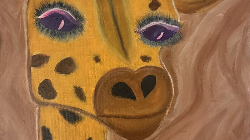 a giraffe with flowers