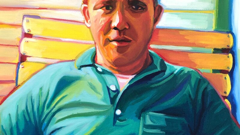 A technicolor up close portrait of a mid century man in his mid thirties. He's wearing a green polo and making eye contact with the camera. 