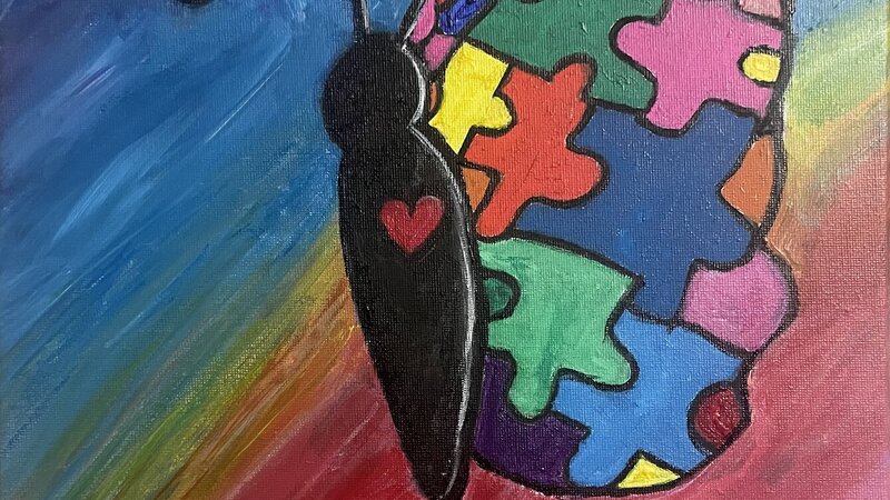 butterfly with multiple color puzzle pieces