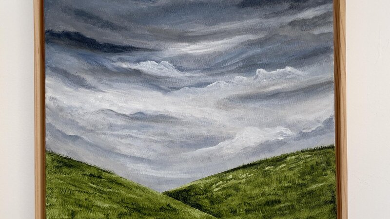 Moody sky and rolling hills