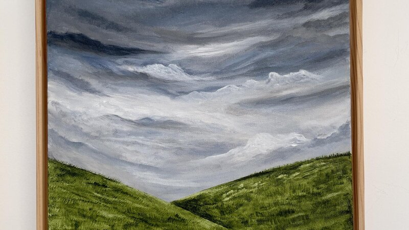 Moody sky and rolling hills