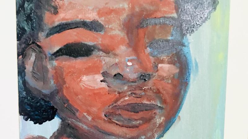 painted black woman with a curly afro