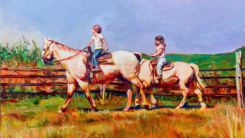 Two little girls from afar on white horses. And older girl is leading in the front. The landscape around them is colorful and dry, like a dessert. 