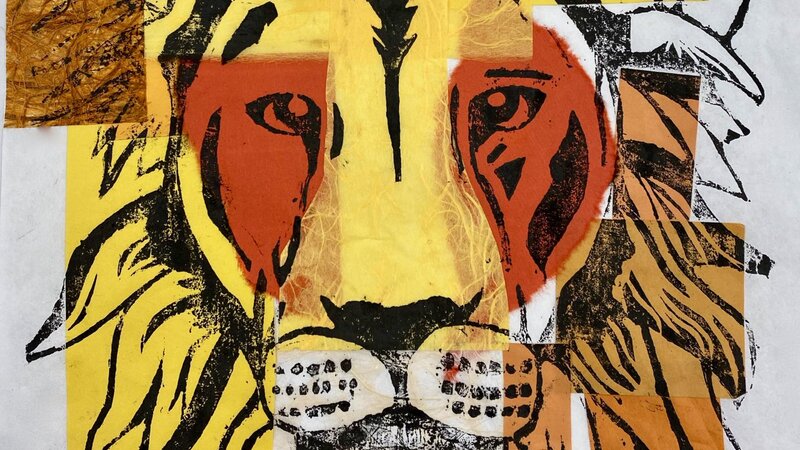 Japanese Style WoodBlock Carving of a Lion profile printed with black ink on sheet of rice paper with pieces of warm colored paper on top.