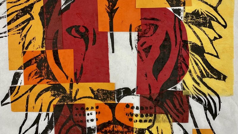 Japanese Style WoodBlock Carving of a Lion profile printed with black ink on sheet of rice paper with pieces of warm colored paper on top.