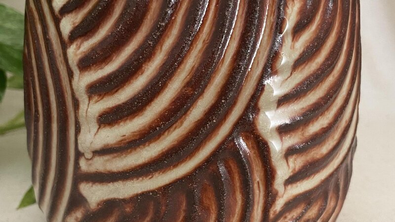 Carved ceramic vessel. 