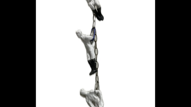 This series of hanging sculptures are on a chain showing emotional physical emotions
