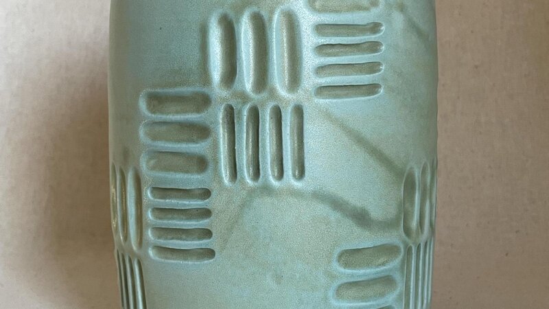 Carved ceramic vessel. 