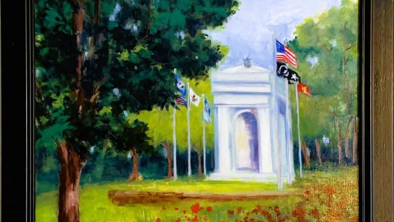 usa war memorial with military flag and field of red poppies in park with tree