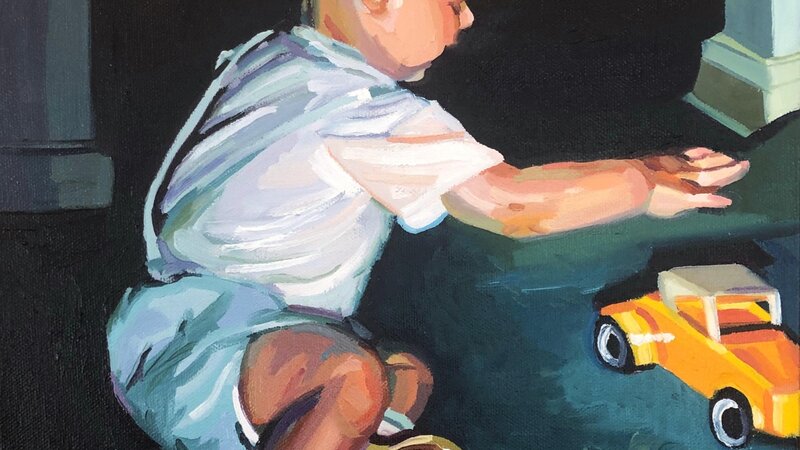 A mid century dressed two year old boy reaching for a yellow toy car. There is strong lighting with a black and dark green room background. 