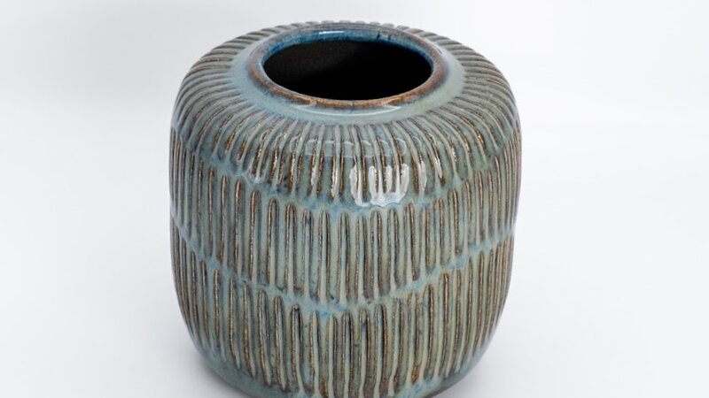 Carved stoneware vessel