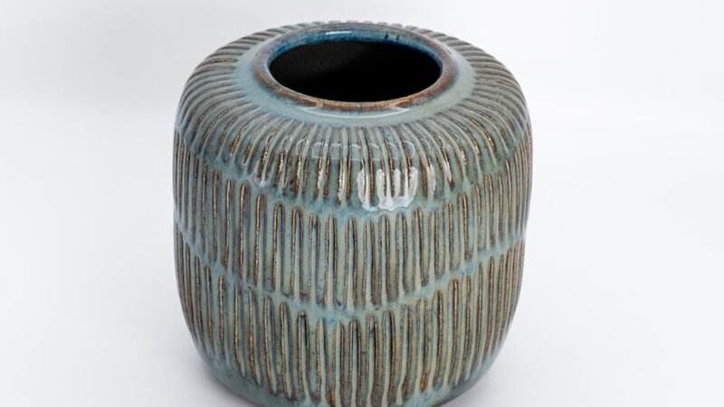 Carved stoneware vessel