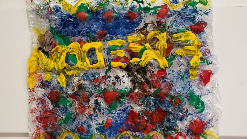 Quilt made of recycled plastic and acrylic paint.