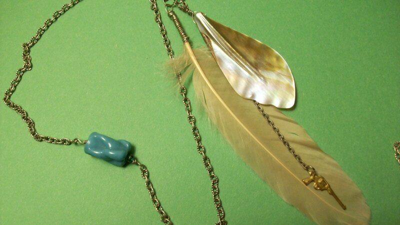 Pink feather necklace with gun charm and shell 