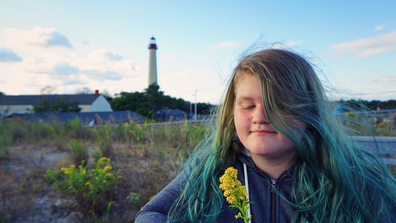 lighthouse, hair, goldenrod, sunset, flowers, girl, clouds, cape may