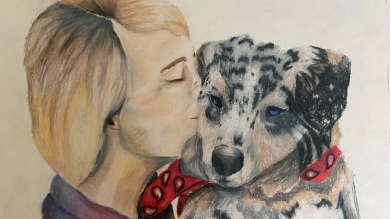 a woman with her puppy