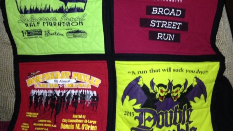 picture of four square quilt with black binding. intended to have stained glass appearance