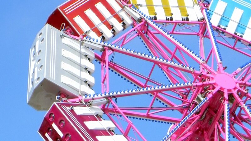 image: photo of a colorful amusement ride title:spin 