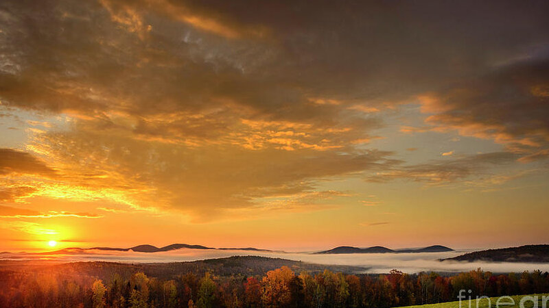 October Sunrise is a view from Phillips, Maine
