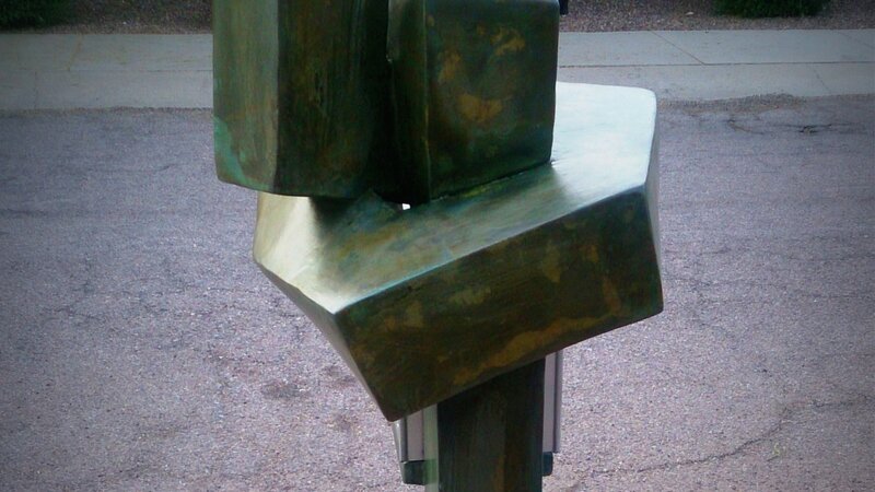 Gripped in a concrete hug. Concrete knot by Rusty Cline: The Embrace