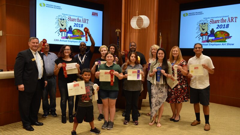 13th Annual Exhibit Proud winners posing with the CEO at the awards reception.