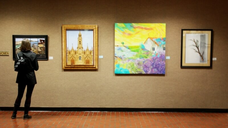 13th Annual Exhibit An attendee taking in a small section of artwork at the NAP exhibit in Ventura County