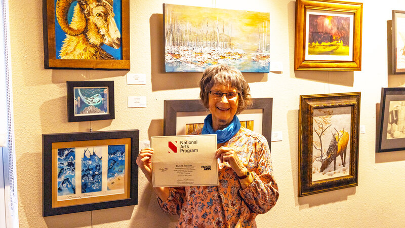 gallery wall with artist Elaine Weaver