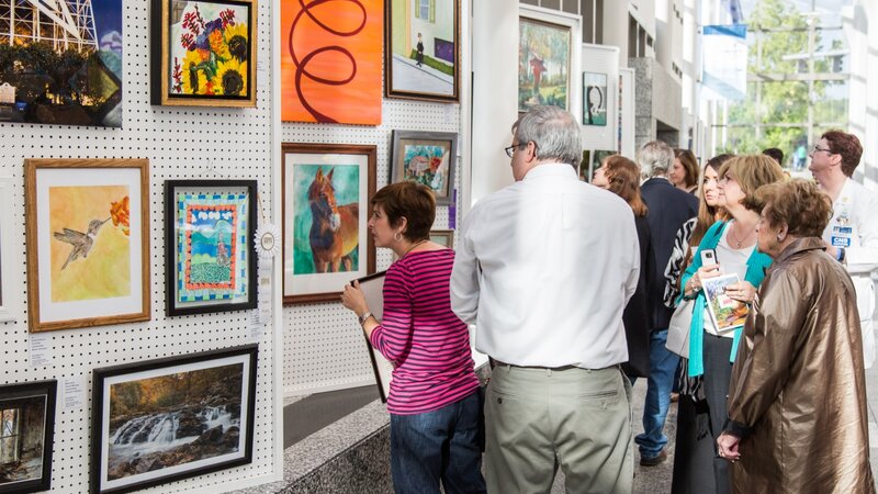 3rd Annual Exhibit Attendees viewing the artwork on display at Carilion Clinic during their awards reception.