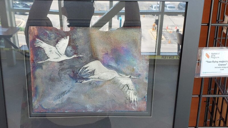 6th Annual Exhibit Two flying majestic Whooping Cranes