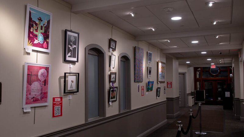 Hallway filled with artworks from the 15th Annual Show