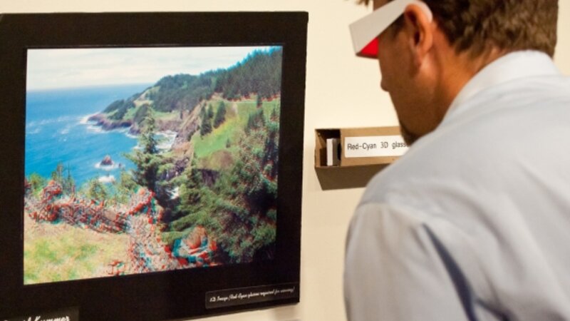 2nd Annual Exhibit Coordinator Joshua Olson interacting with the 3D piece in the 2010 Show