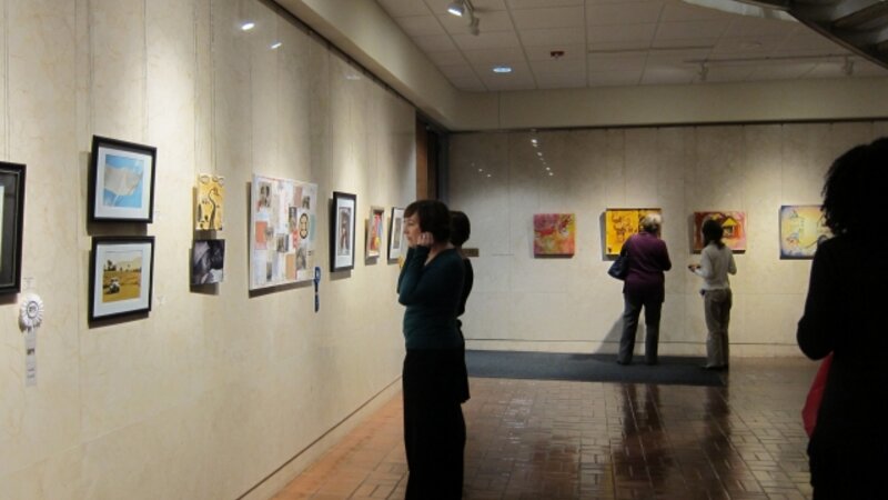 10th Annual Exhibit Attendees taking in the artwork at the Block Gallery in the Raleigh Municipal Building 