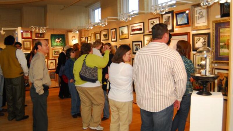 2nd Annual Exhibit People taking in the art at the awards reception.
