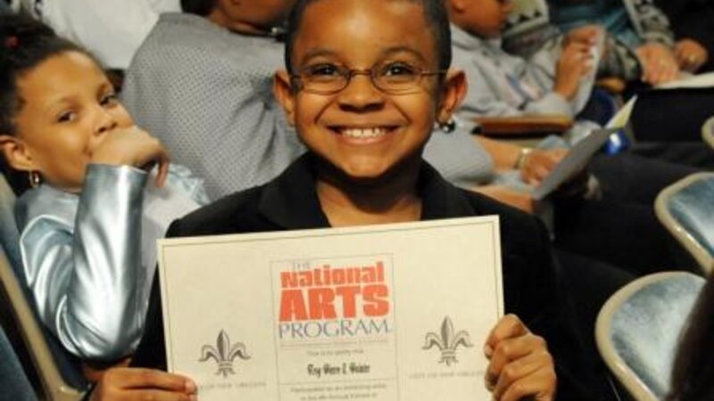 4th Annual Exhibit Participant, Troy Pierre II Holding Certificate of Participation