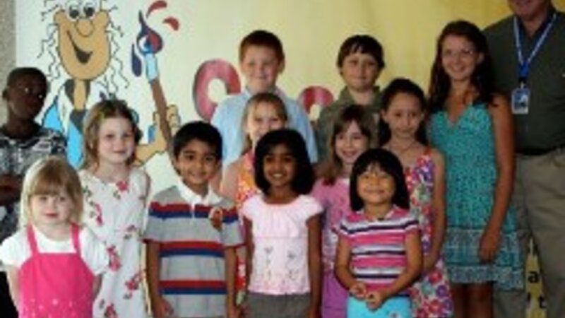 4th Annual Exhibit Steve Gardner, Executive Director of the Greater Orlando Aviation Authority and the participating artists in the Youth Under 12 category.