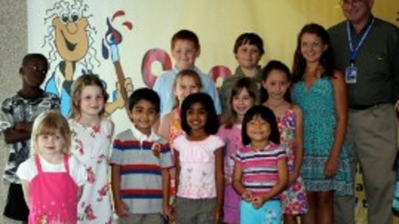 4th Annual Exhibit Steve Gardner, Executive Director of the Greater Orlando Aviation Authority and the participating artists in the Youth Under 12 category.